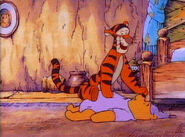 Tigger bounces Pooh Bear again