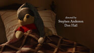 Winnie the Pooh is a stuffed toy bear sleeping in bed