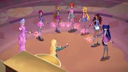 Eldora is holding Stella's wand. Stella is holding Musa's wand. Aisha is also holding Bloom's wand. Musa is holding Aisha's wand.