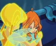 Стелла согревает Блум при помощи магии Солнца