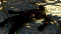 A burnt corpse by the entrance.