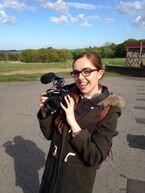 Tweeted by "@LettyButler" on May 14, 2014: "Lady FitHead has a camera and she's not afraid to use it. #uhoh #wolfblood #lousloose".