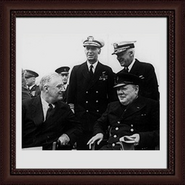 The Royal Navy During The Second World War, President Franklin D. Roosevelt and Prime Minister Winston Churchill. Immediately behind them are Admiral E J King, USN and Admiral Stark, USN. Taken after Divine Service on board HMS Prince of Wales, in the North Atlantic off the coast of Newfoundland, Aug. 10, 1941, just before the Atlantic Conference Aug 14, 1941.