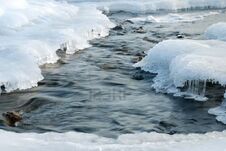 2389437-the-winter-river-an-ice-hole-in-the-frozen-river-with-a-rough-stream