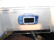 WonderSwan Color with MP3 cartridge on display at the 2001 Tokyo Game Show.