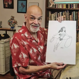 George Perez holding WW drawing