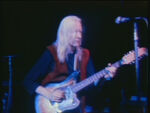 Johnny Winter with a 12-string guitar, which was strung with only 6-strings