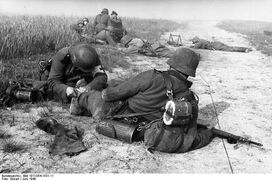 German Medic Treating a Wounded Soldier, France 1940