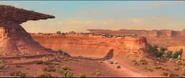 The World Grand Prix racers going around Willy's Butte in Cars 2