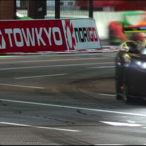 Neon Painted Race Car Drifting Inside Race Track GIF