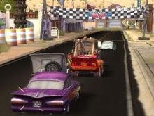 Lightning, Mater, Flo, Sarge and Ramone in an arcade race.