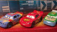 Johnny Blamer in a 1:55 diecast 3-pack with Lightning McQueen and Sage VanDerSpin.