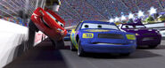 Lightning McQueen carefully passing Floyd Mulvihill and Rusty Cornfuel in a Piston Cup race.