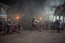 Loial fights back against the Seanchan during the attack at Atuan's Mill