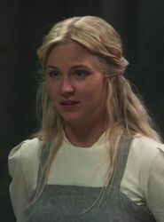Unnamed novice (portrayed by Salle Salée) in episode 201, during a lesson with Alanna in the kitchens