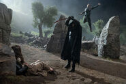 Episode 201 behind the scenes: A Fade raises its sword to kill Moiraine, and behind it, Lan leaps to attack