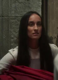 Unnamed novice (portrayed by Raquel Cipriano) in episode 202, carrying laundry from Liandrin's room