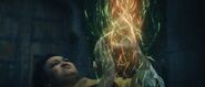 Amico channels a weave of fire and earth to topple a bell tower.