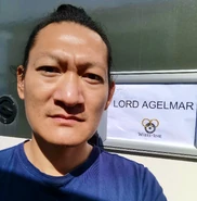 Chaanhing in front of his trailer labeled "Lord Agelmar". Twitter, June 23, 2022.
