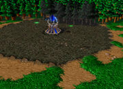 A  surrounded by blighted ground in Warcraft III.