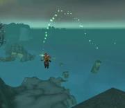 Landgren jumping off the cliff.