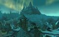 Close up of the ruins of lower Wintergarde, with Naxxramas in the distance.