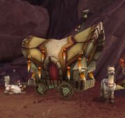 A vulpera wagon with alpaca draft animals.