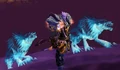 Draenei shaman with his spirit wolves after casting the Feral Spirit spell.