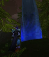 A stone with a blue light around it.