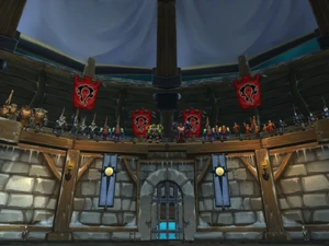 Thrall standing next to Garrosh Hellscream in the Horde section of the Crusaders' Coliseum
