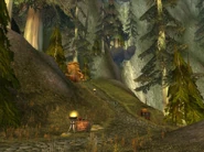 Up the hill leading to the cave; the grand waterfall in the background.