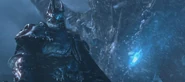 The Lich King, in the WotLK cinematic, with Sindragosa emerging from the ice behind him.