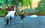 A Pandaren warrior in combat against what appears to be a crane.