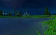 Bloodhoof Village as seen over Stonebull Lake at night.