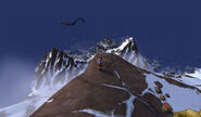 Onyx Serpent flying past Neverest Pinnacle with the Peak of Serenity behind/downhill