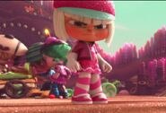 Taffyta scowling down at Vanellope angrily