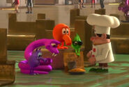Peter Pepper offers Q*bert and the gang some food.