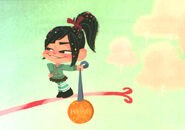 Vanellope steals Ralph's medal.