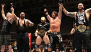 Bullet Club celebrate winning a 10-man tag team match in 2015.