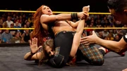 Lynch applying her finisher the Dis-arm-her during her time in NXT.