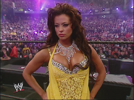 Melina stripping off Candice Michelle's pants in a Bra & Panties match