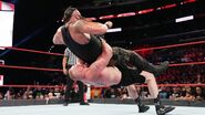 Strowman with another suplex by Lesnar