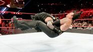 The Undertaker getting spear by Roman Reigns