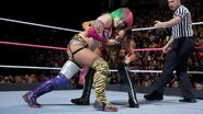 Asuka putting Emma in a headlock