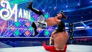 Styles lands a forearm on Nakamura
