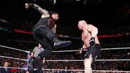 Reigns hit Lesnar with a superman punch