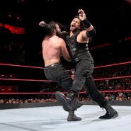 Elias into the clothesline from Reigns