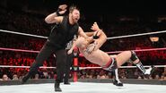 Ambrose floors Cesaro with a massive clothesline