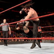 Reigns hit from a savage kneeof Elias