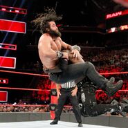 Elias in a spinebuster by R-Truth